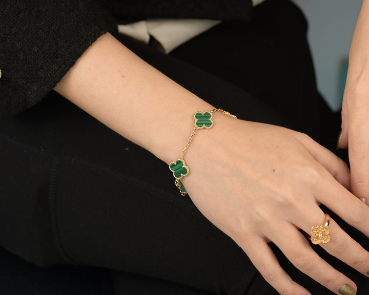 Van Cleef & Arpels 5 Motif Vintage Alhambra Malachite Yellow Gold Bracelet modelling photo