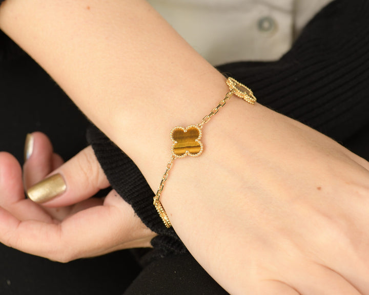 Van Cleef & Arpels Tiger's Eye Vintage Alhambra 5 Motif Gold Bracelet modelling photo