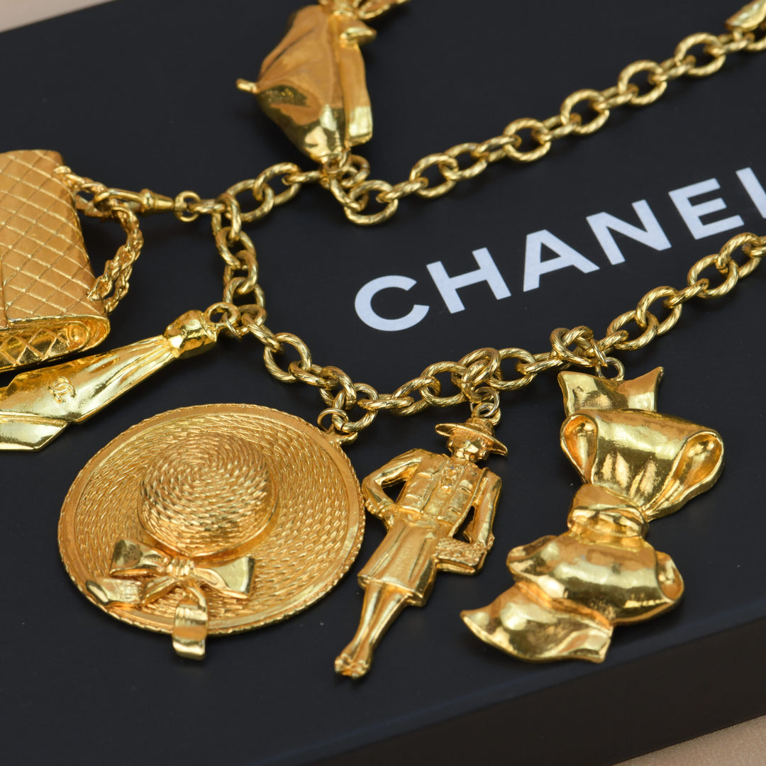 Chanel Vintage Gold Plated Chain Necklace with Six Iconic Charms –  Dandelion Antiques