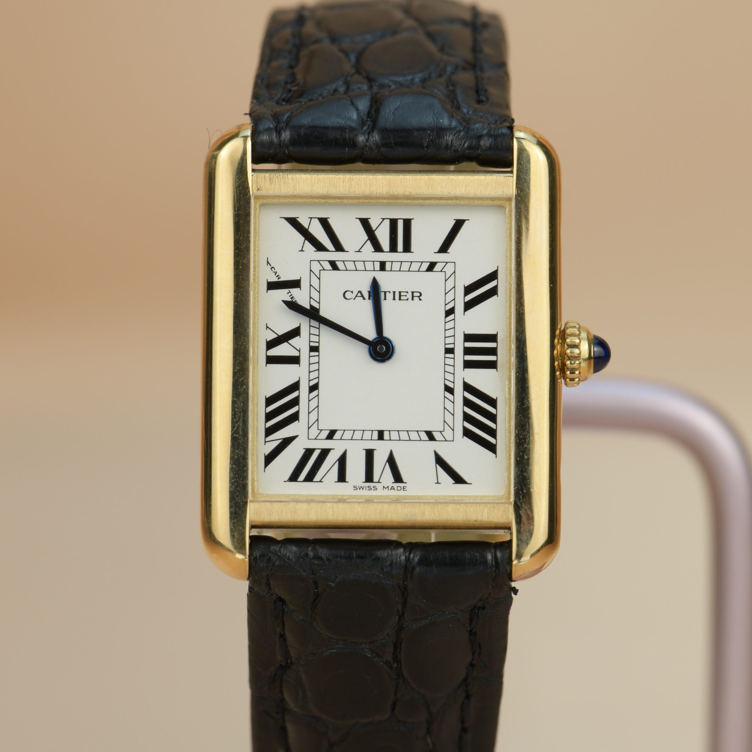 Cartier black and gold on sale watch