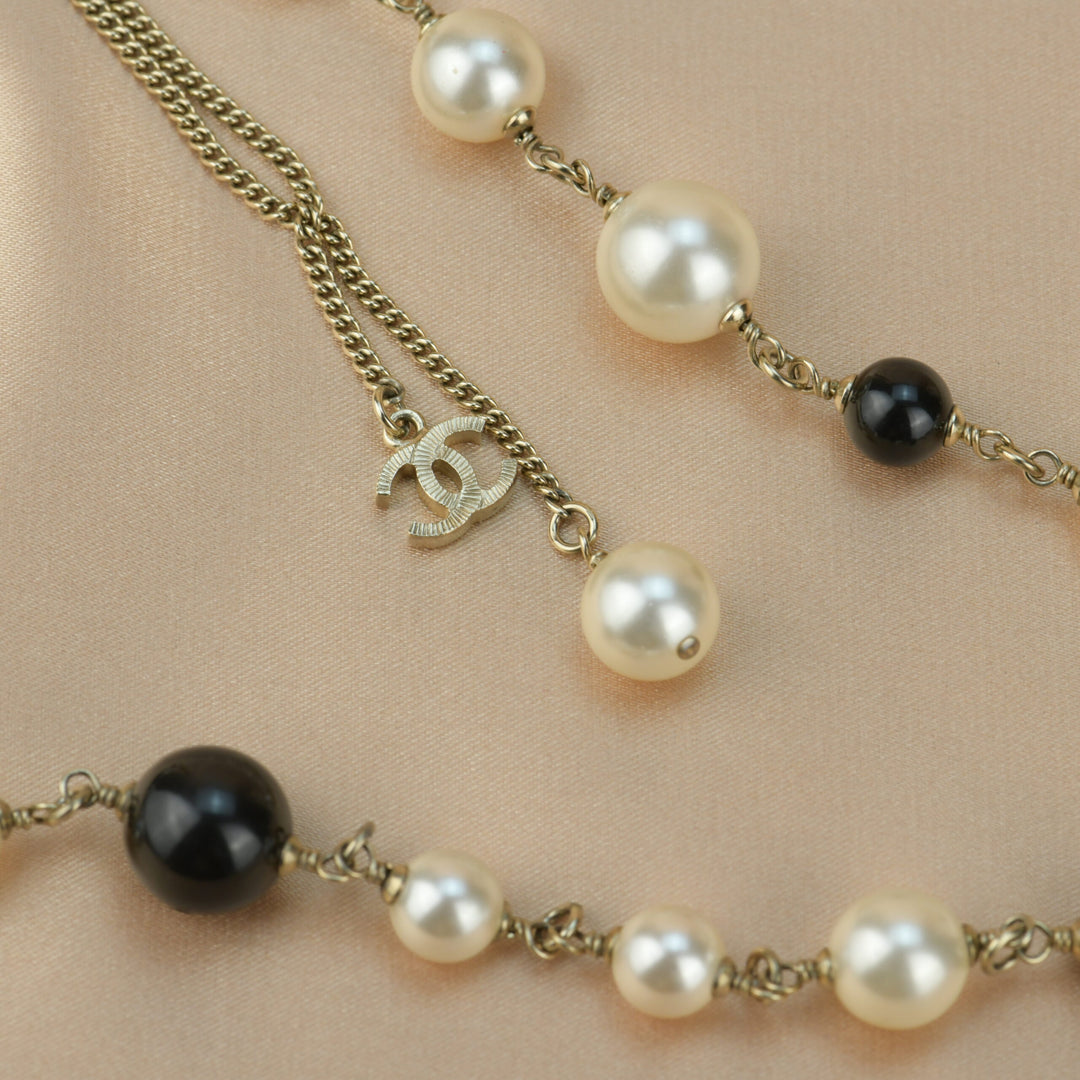 Chanel CC Logo Black Enamel Long Pearl Necklace In Gilt Gold – Dandelion  Antiques