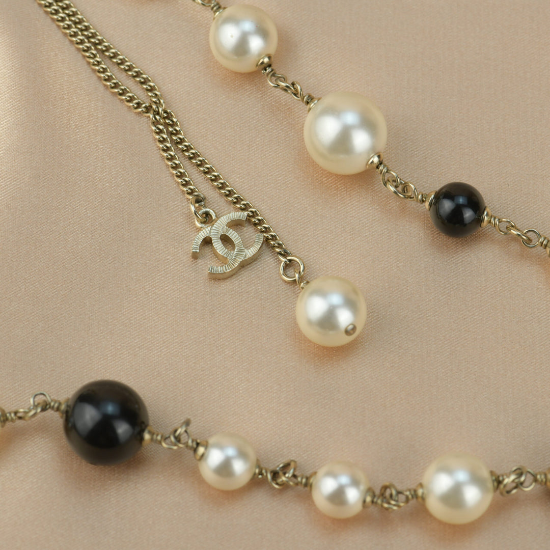 Chanel CC Logo Black Enamel Long Pearl Necklace In Gilt Gold