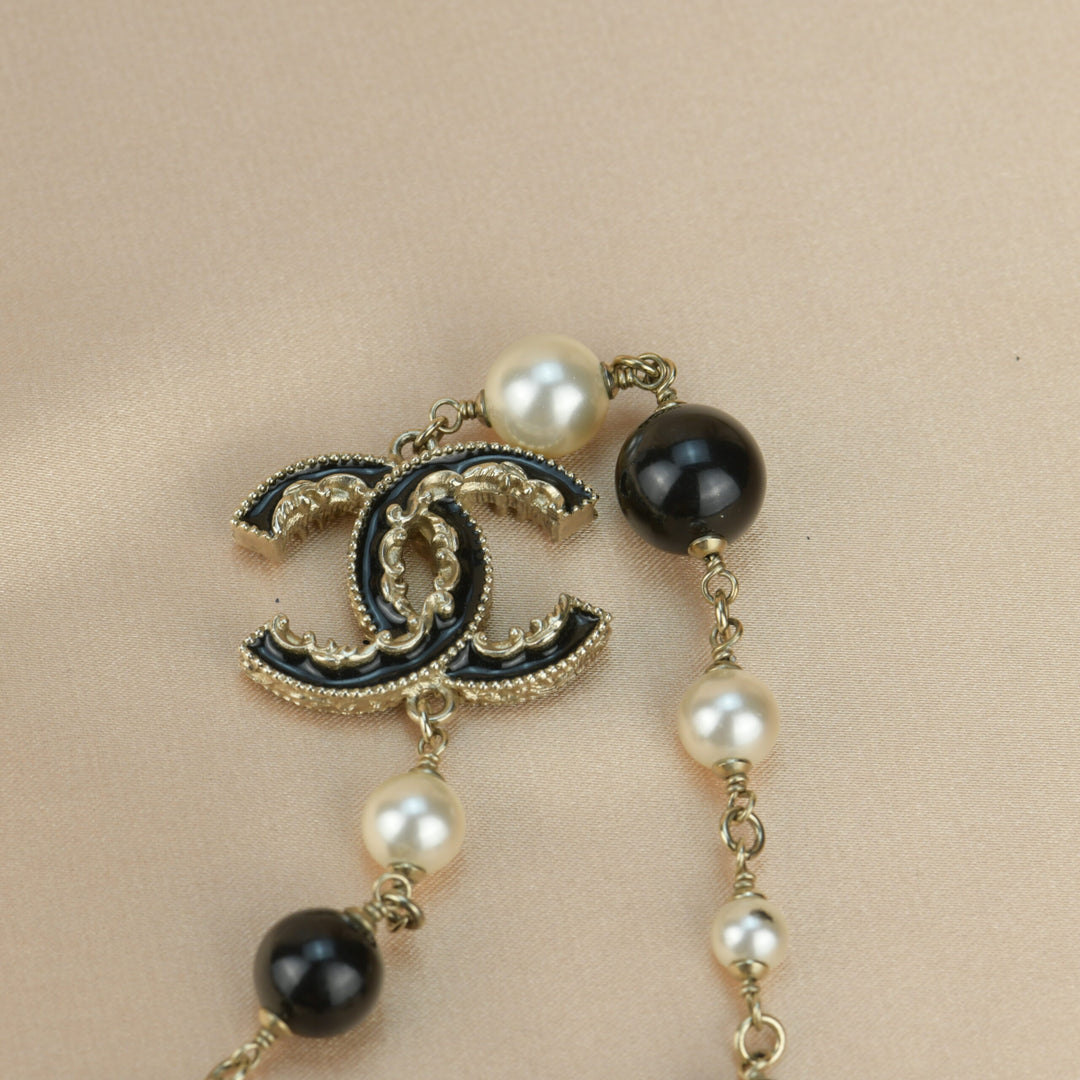 Chanel Vintage Gold Metal, Black Enamel, And Imitation Pearl