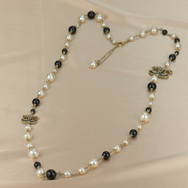 Chanel CC Logo Black Enamel Long Pearl Necklace In Gilt Gold