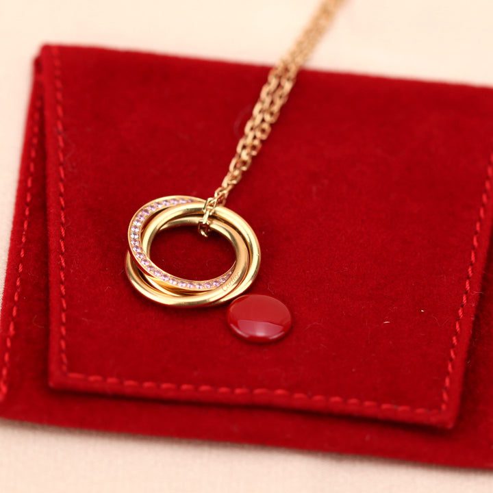 Cartier White, Yellow, Rose Gold and Pink Sapphire Trinity Pendant Necklace