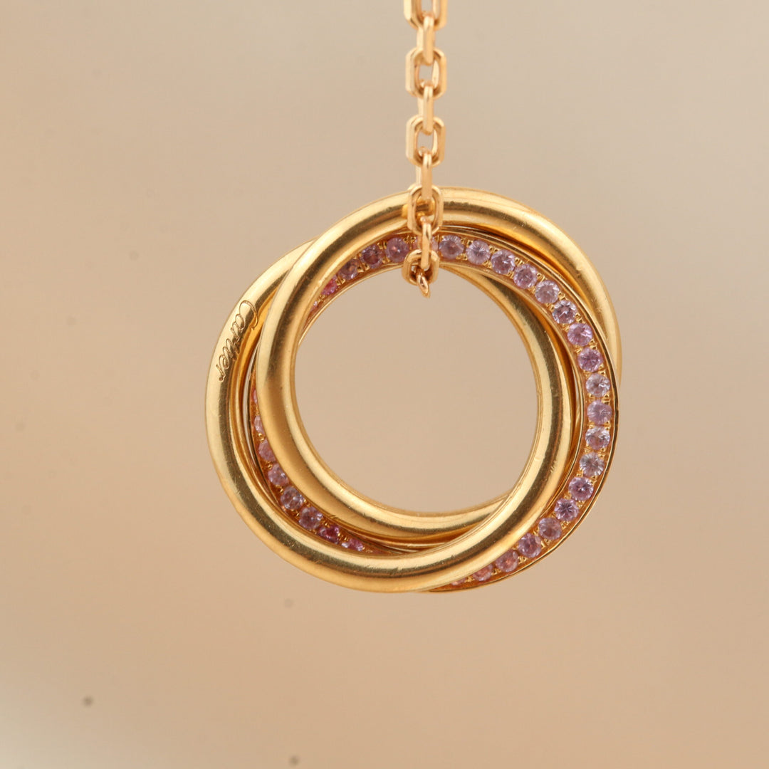 Cartier White, Yellow, Rose Gold and Pink Sapphire Trinity Pendant Necklace