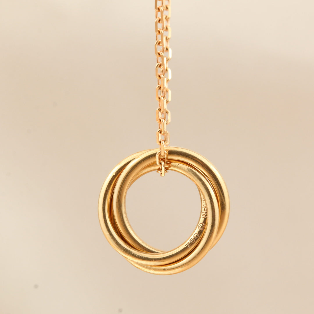 Cartier White, Yellow, Rose Gold and Pink Sapphire Trinity Pendant Necklace