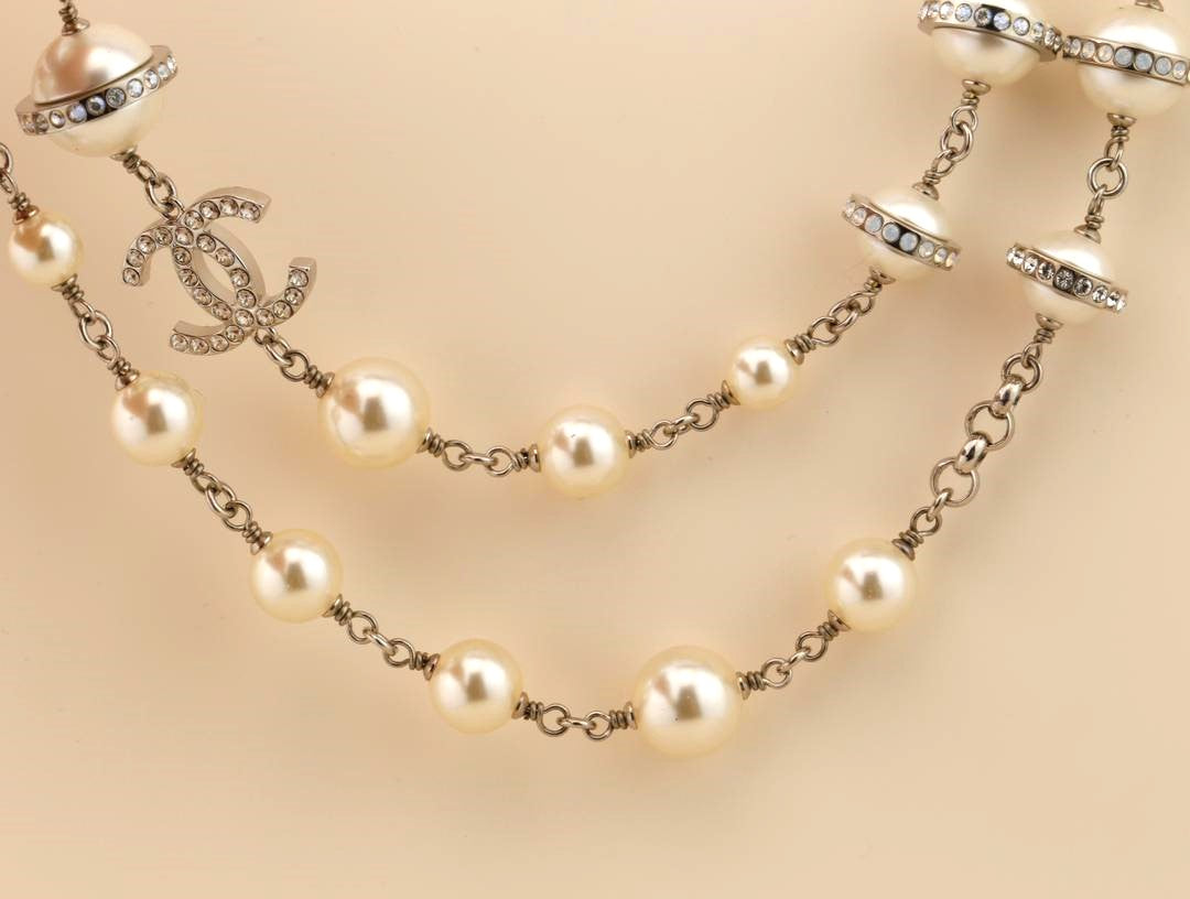 Vintage CHANEL CC Logo Triple Strand Pearl Necklace For Sale at 1stDibs  chanel  double strand pearl necklace, chanel triple strand pearl necklace, chanel  pearl necklace