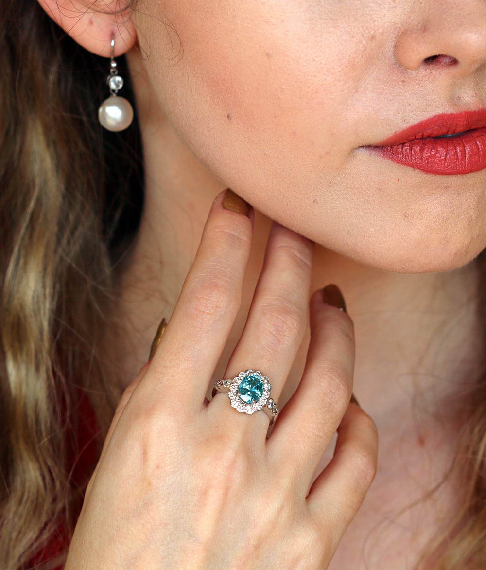 Blue zircon and diamond cluster ring on a model