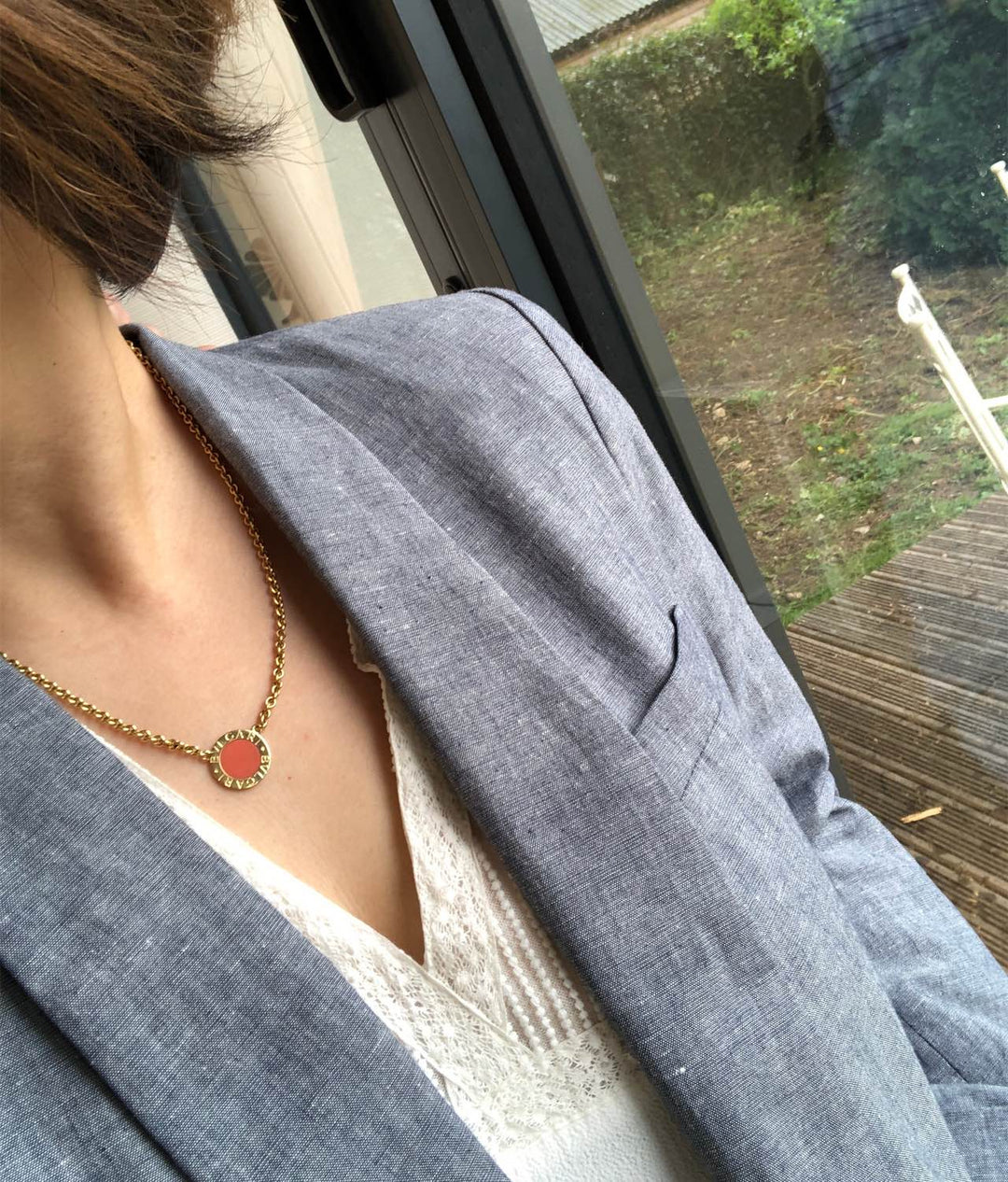 Model wearing Bulgari Coral and Gold Pendant Necklace