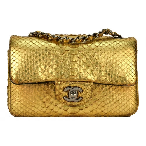 CHANEL Classic flap bag in exotic golden python