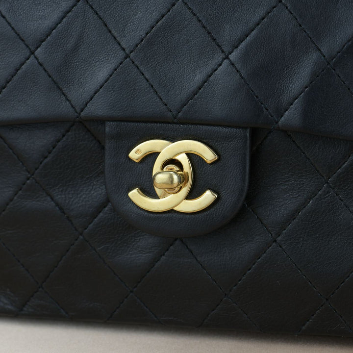 CHANEL Black Quilted Lambskin Mini Square Flap Bag