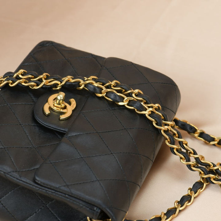 CHANEL Black Quilted Lambskin Mini Square Flap Bag