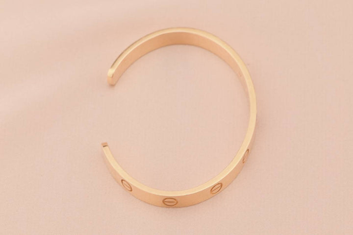 Cartier rose gold love bangle with pink sapphire size 17