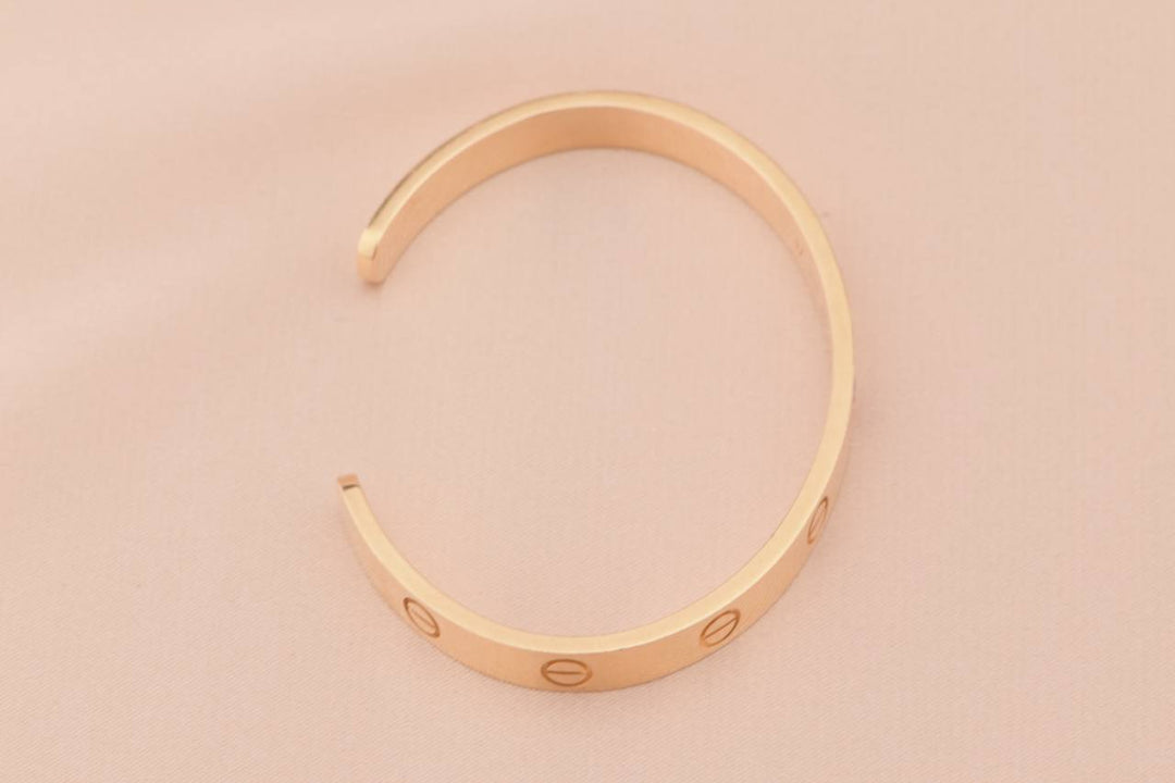 Cartier rose gold love bangle with pink sapphire size 17
